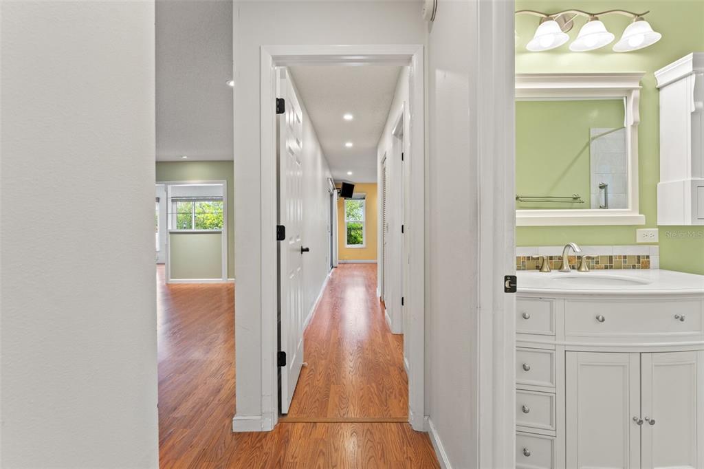2233 Timber Lodge Lane Spring Hill, FL 34606 - Photo 32 of 59 a view of a hallway with wooden floor and staircase
