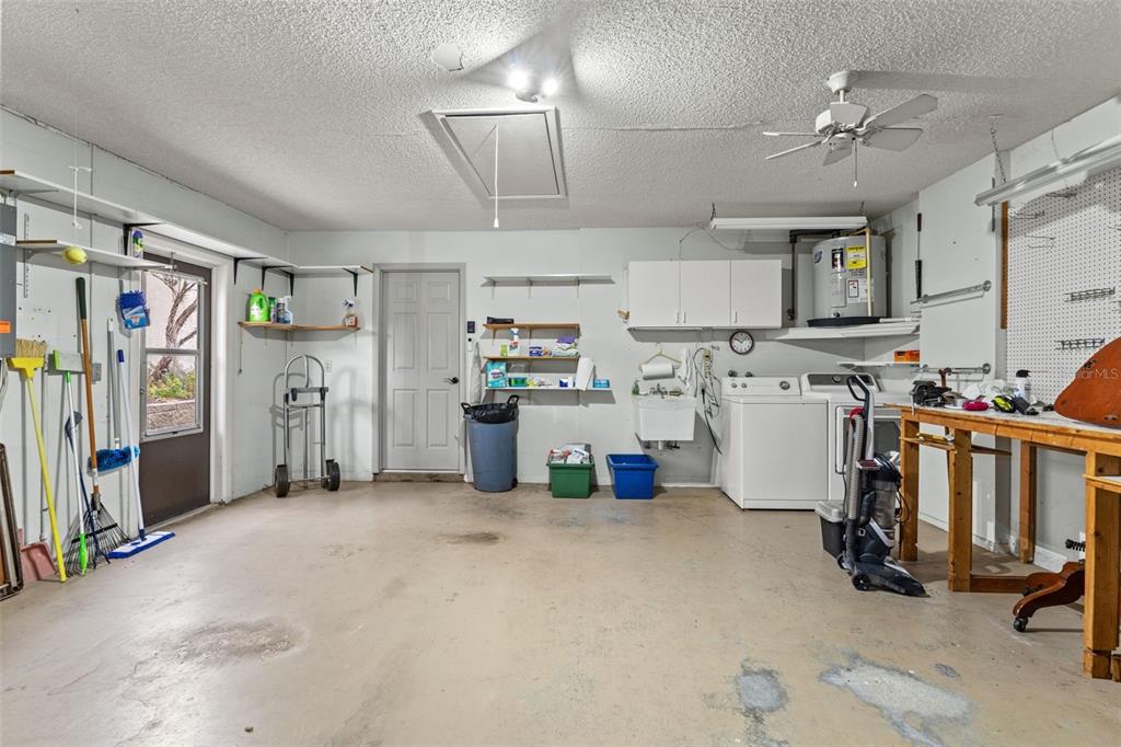 2233 Timber Lodge Lane Spring Hill, FL 34606 - Photo 35 of 59 a view of a kitchen with fridge and workspace