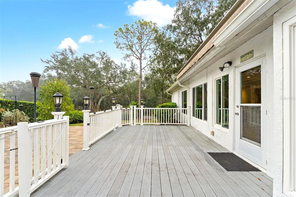 2233 Timber Lodge Lane Spring Hill, FL 34606 - Photo 38 of 59 a view of a house with wooden deck
