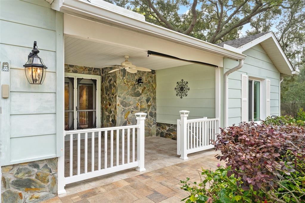 2233 Timber Lodge Lane Spring Hill, FL 34606 - Photo 7 of 59 a front view of a house with a porch