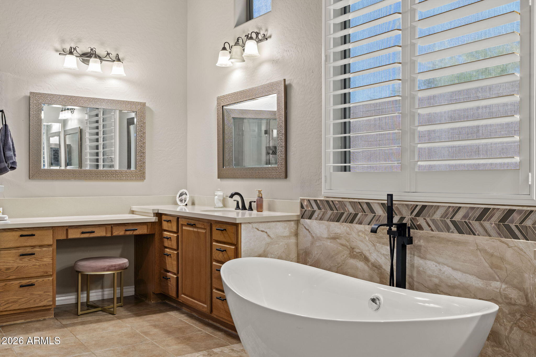 41619 North River Bend Road Anthem, AZ 85086 - Photo 56 of 84 a bathroom with a bathtub and a sink