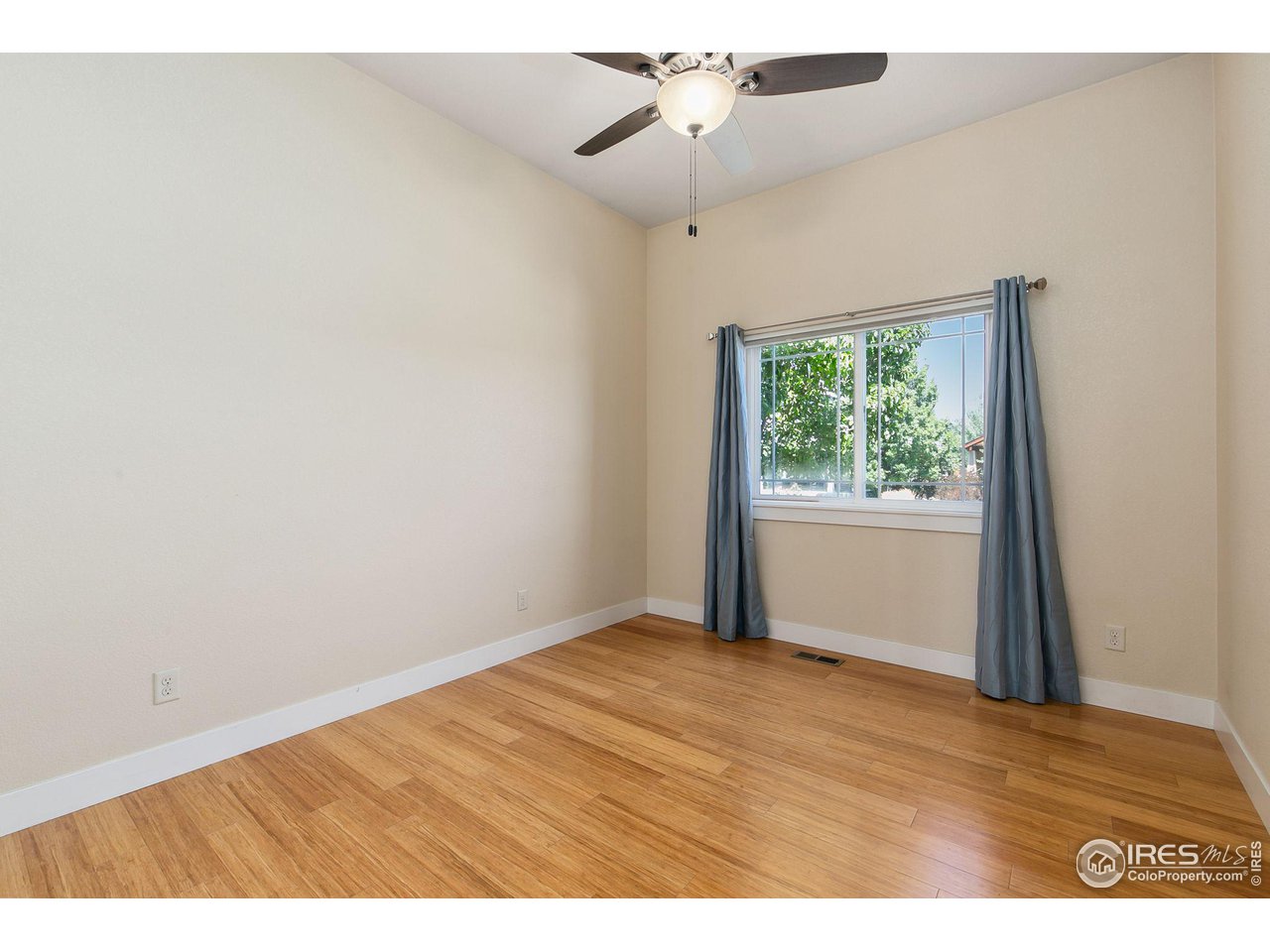 55 Veronica Drive Windsor, CO 80550 - Photo 14 of 24 Open and light spare bedroom on the main level