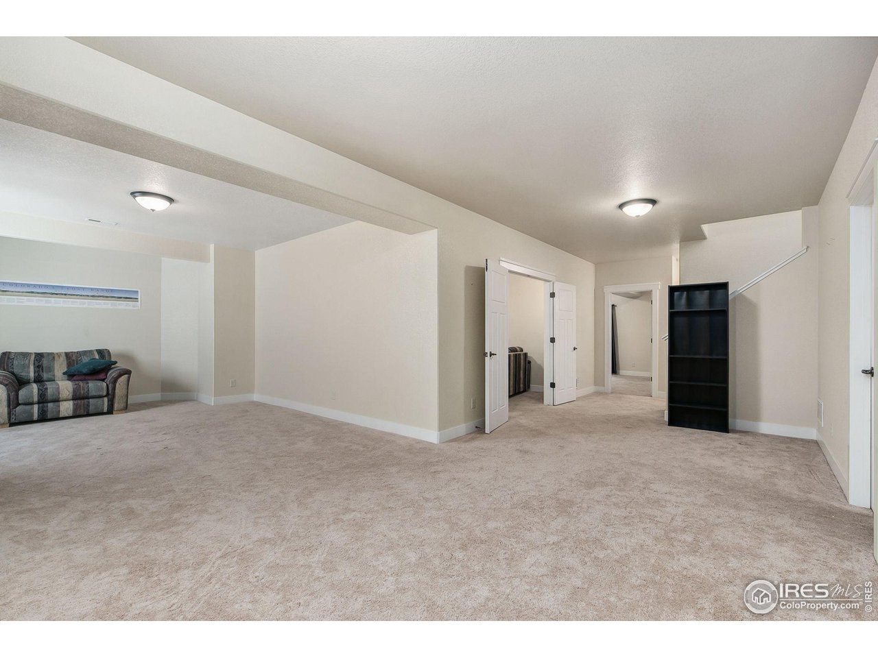 55 Veronica Drive Windsor, CO 80550 - Photo 17 of 24 Large open living space in the finished basement