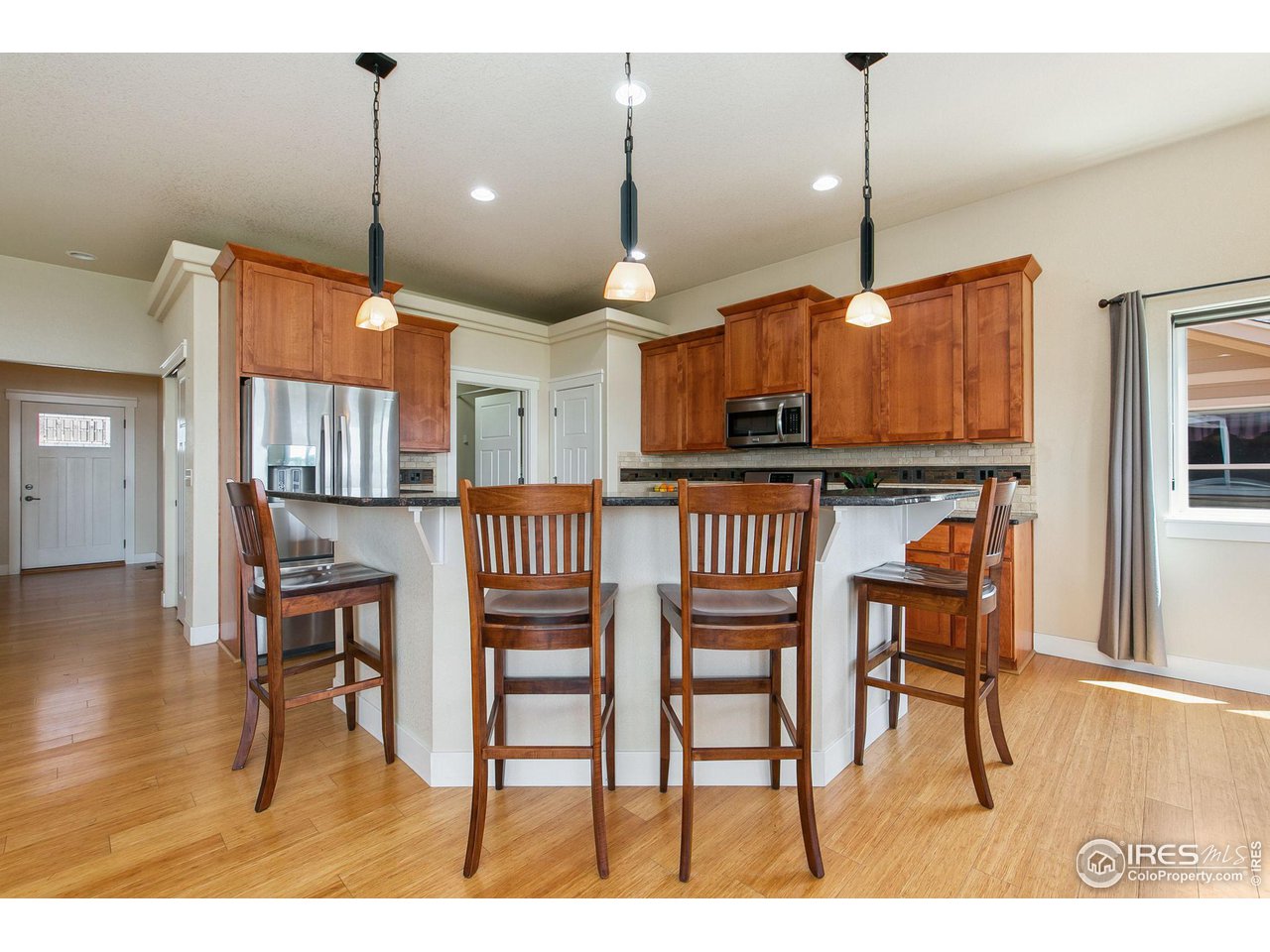 55 Veronica Drive Windsor, CO 80550 - Photo 9 of 24 Additional bartop seating