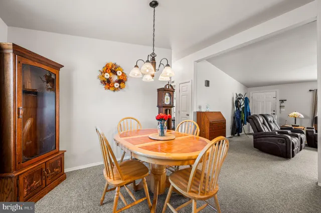 a white refrigerator freezer and a stove sitting inside of a kitchen
