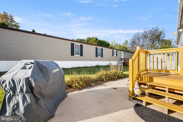 a view of a patio with wooden fence