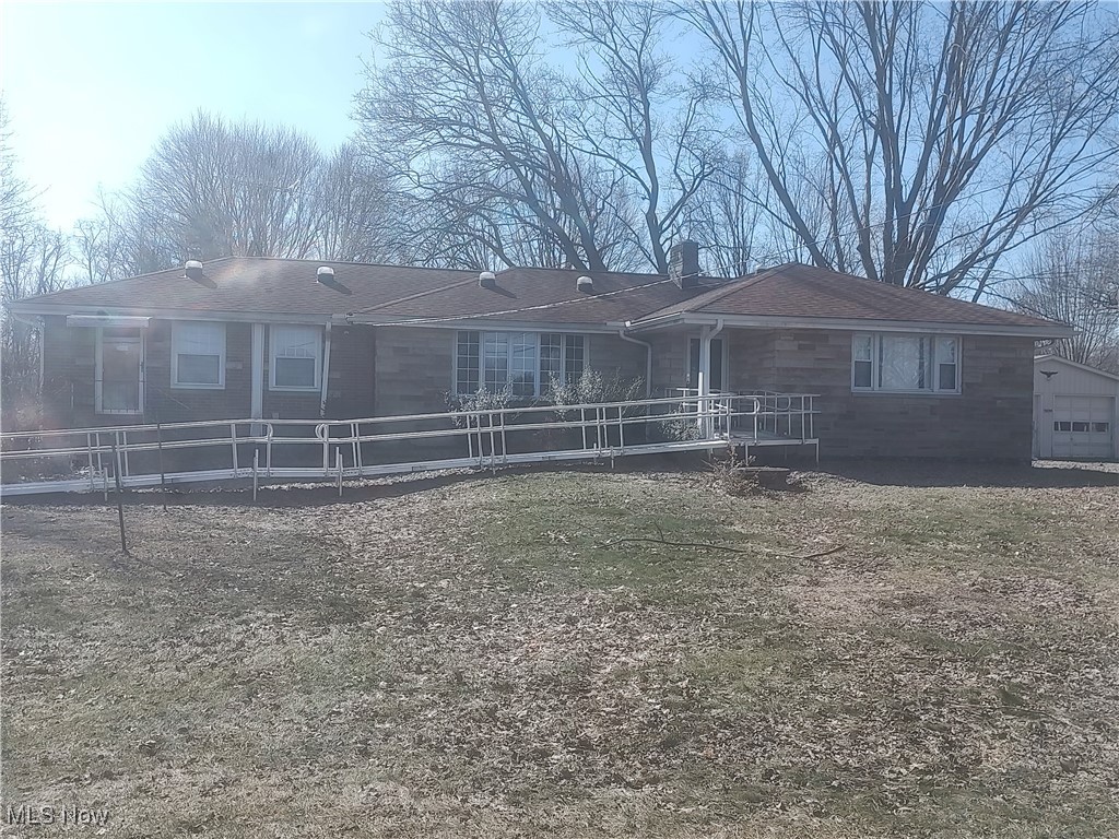 5704 Middle Ridge Road Madison, OH 44057 - Photo 27 of 50 View of front facade with a chimney