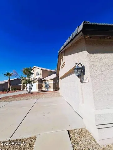 a view of a patio with a table and chairs