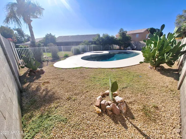 a view of a backyard of the house