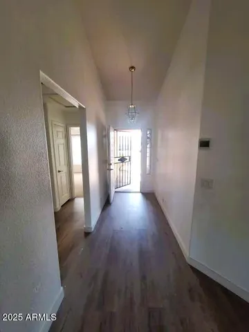 a view of gallery with wooden floor