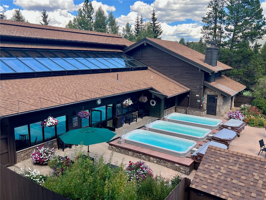 570 Bills Ranch Road, Unit 335 Frisco, CO 80443 - Photo 13 of 43 a front view of a house with a yard table and chairs