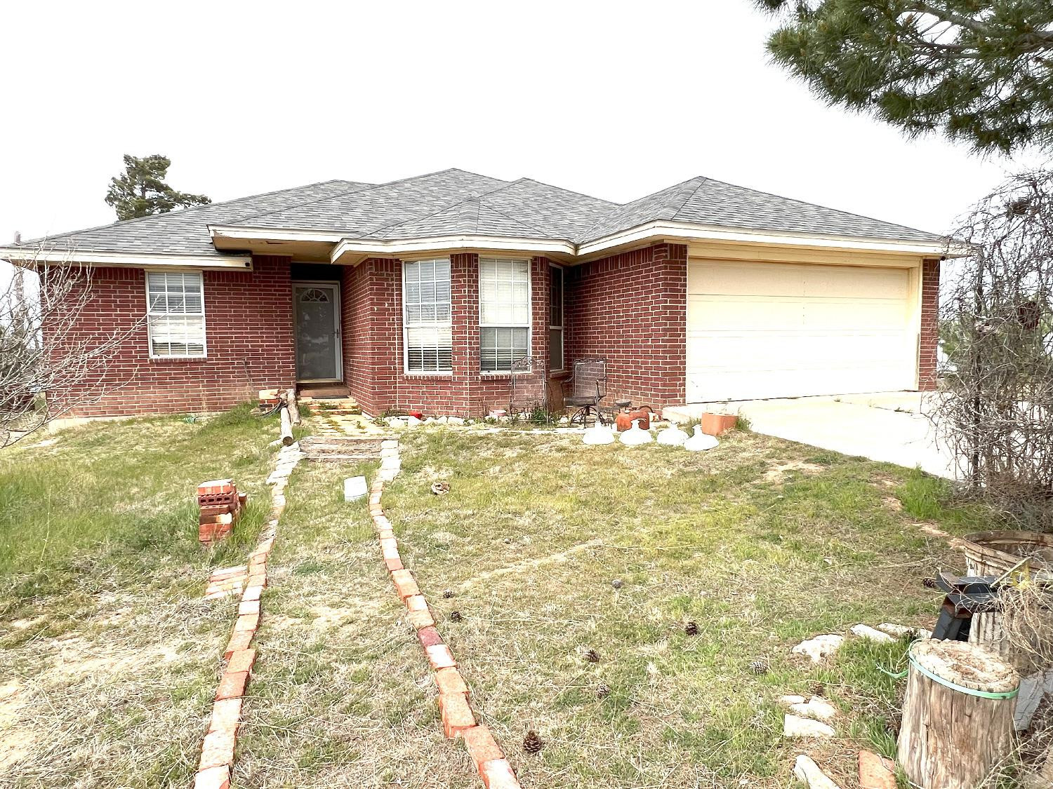 2314 Farm To Market 41 Lubbock, TX 79423 - Photo 1 of 18 a front view of a house with a yard