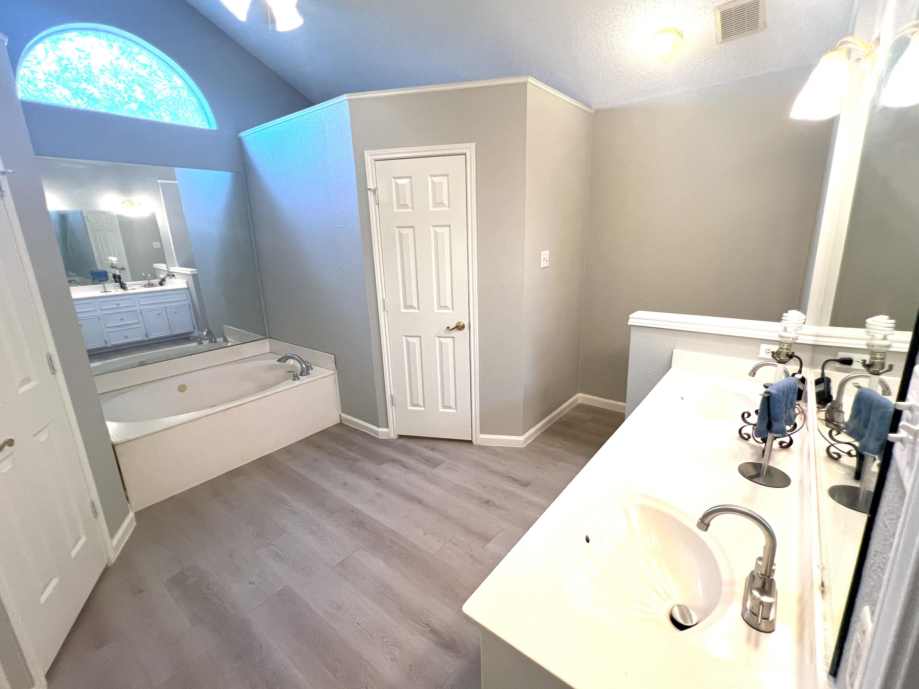 2314 Farm To Market 41 Lubbock, TX 79423 - Photo 16 of 18 a en suite bathroom with a double vanity sink and mirror