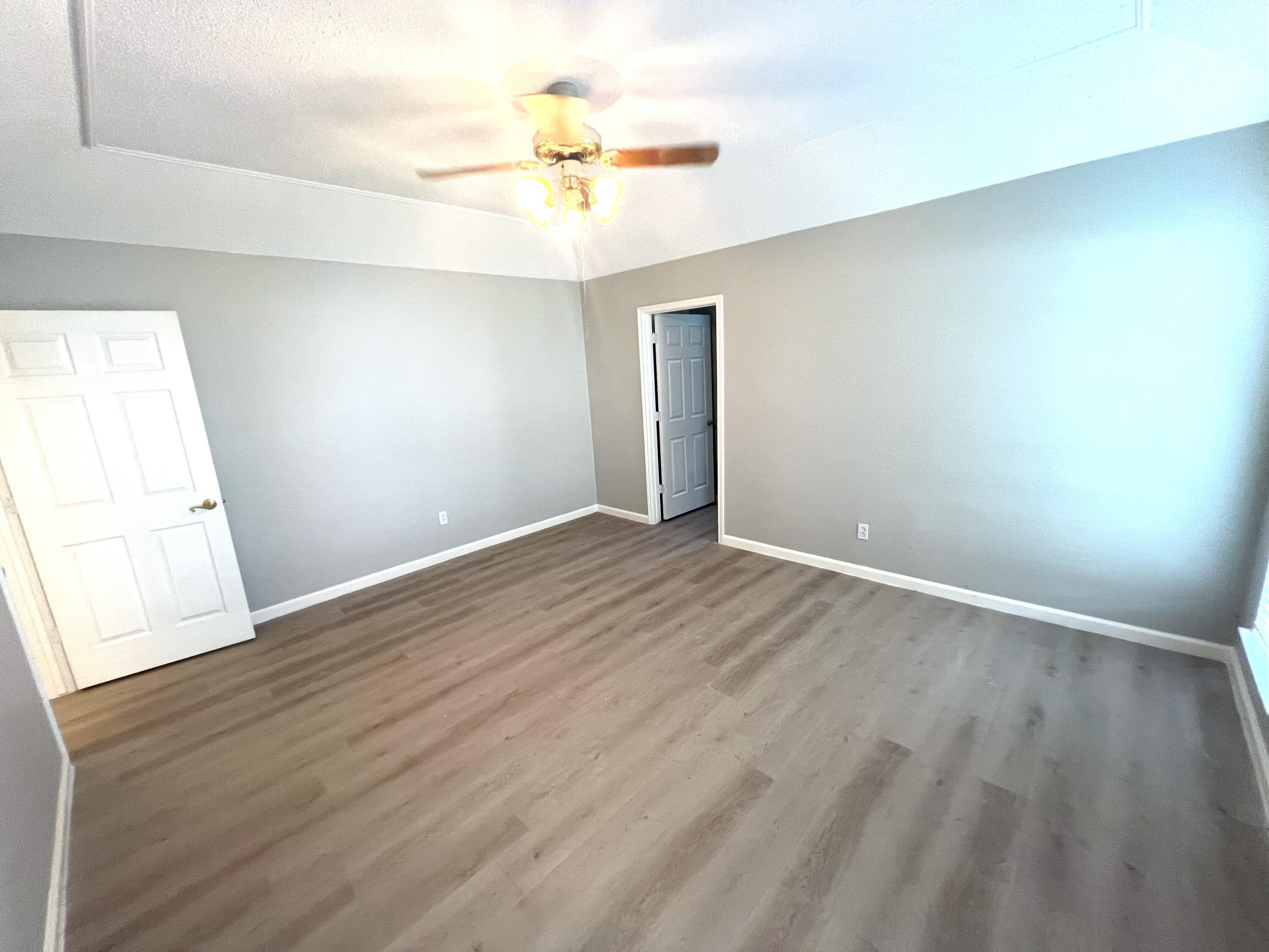 2314 Farm To Market 41 Lubbock, TX 79423 - Photo 18 of 18 wooden floor in an empty room with a window