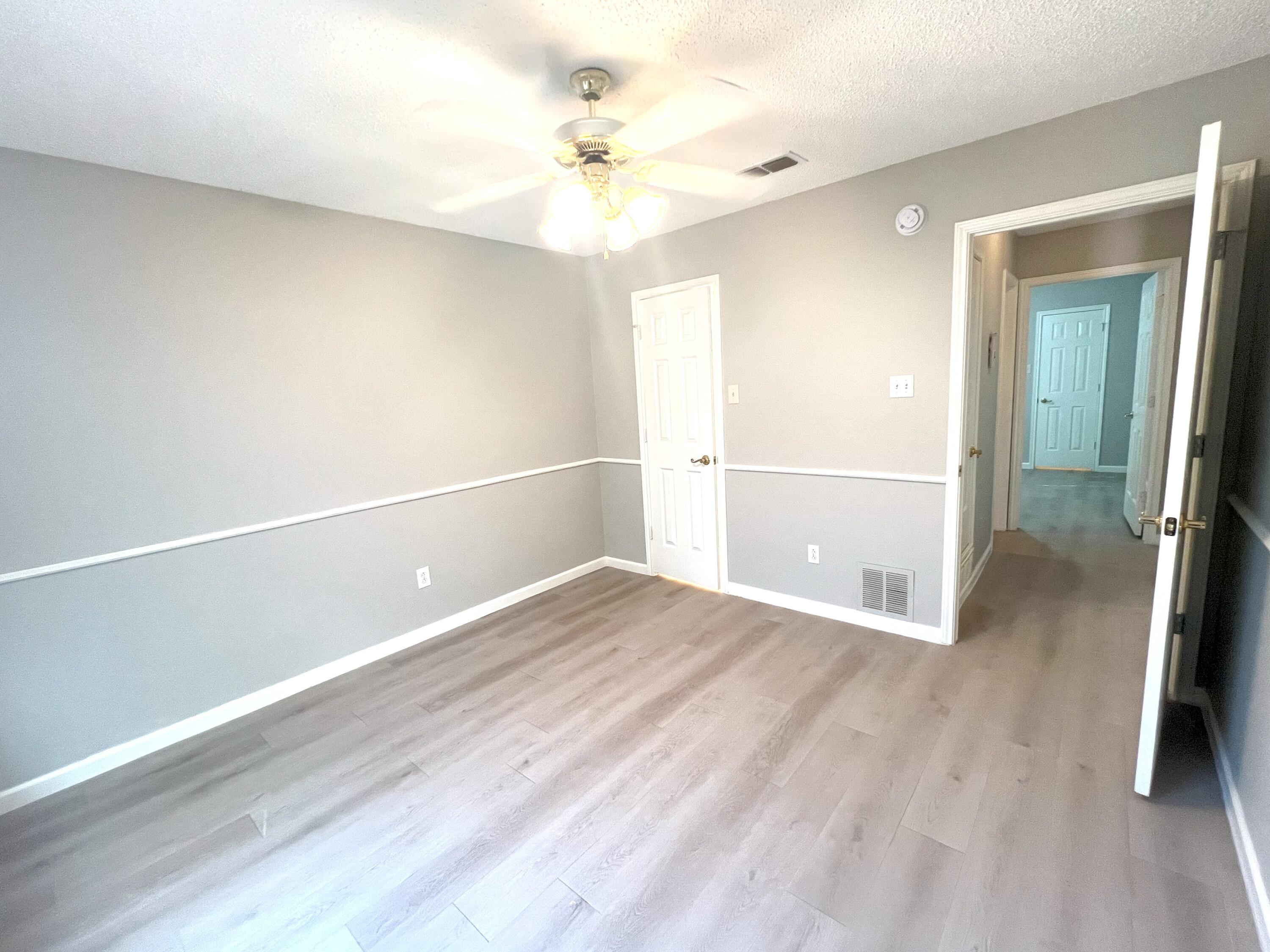 2314 Farm To Market 41 Lubbock, TX 79423 - Photo 4 of 18 a view of an empty room with wooden floor