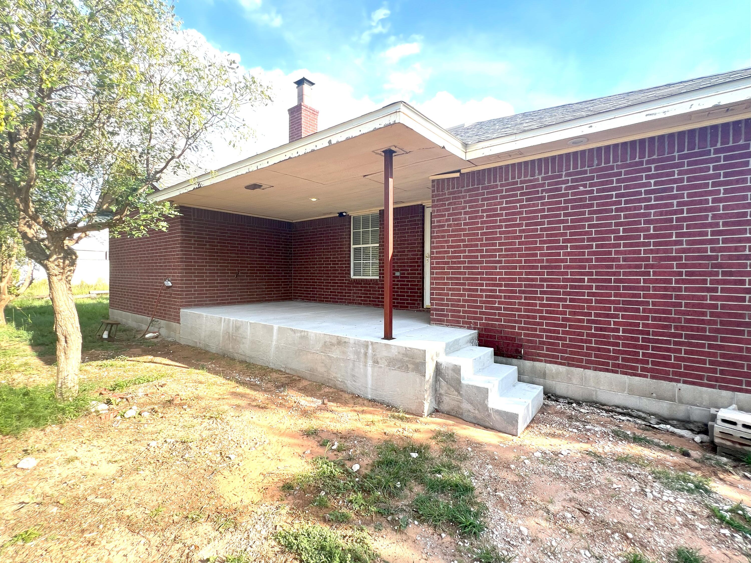 2314 Farm To Market 41 Lubbock, TX 79423 - Photo 8 of 18 a front view of a house with a yard