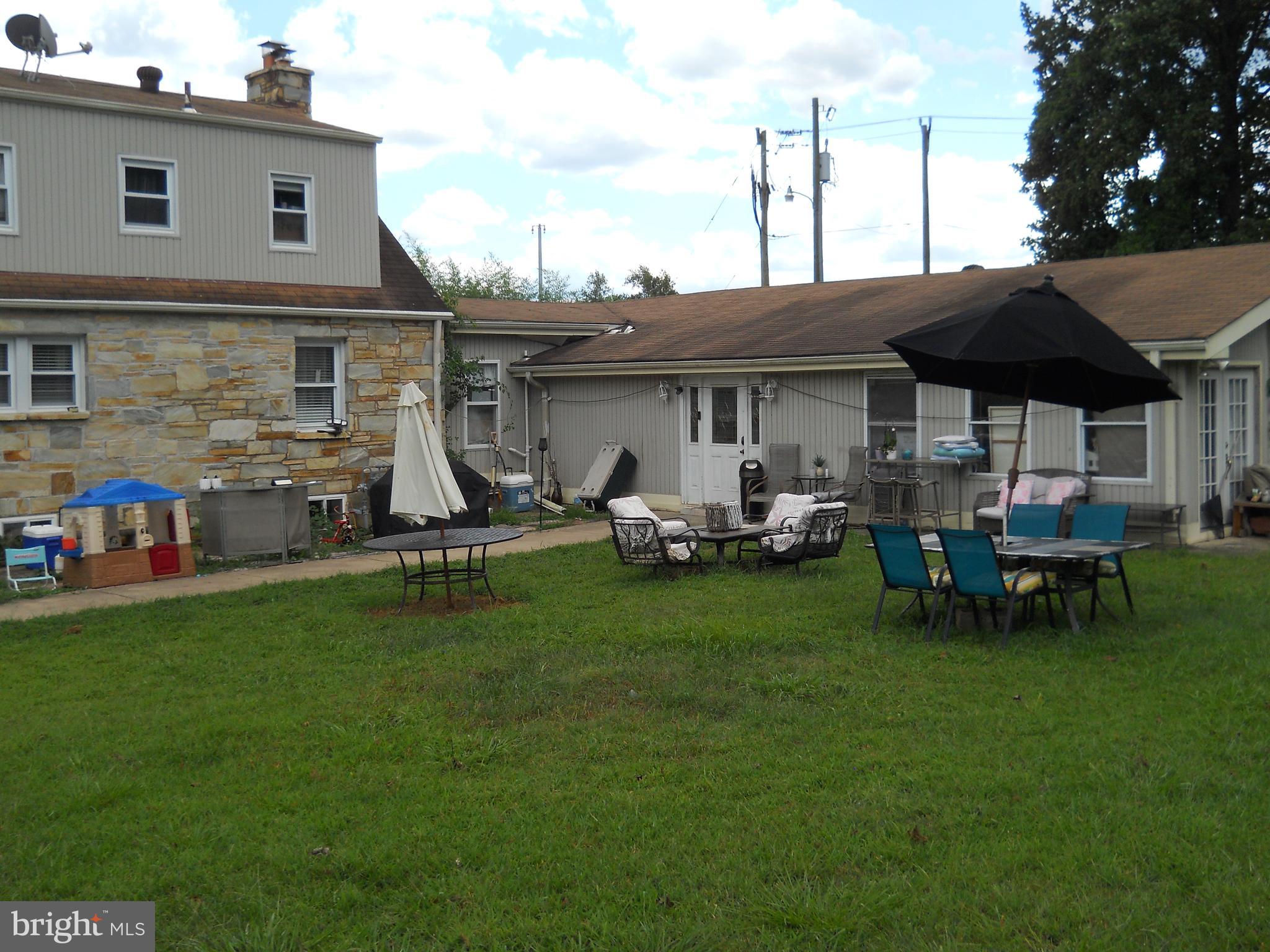 3424 Jermantown Road Fairfax, VA 22030 - Photo 13 of 19 a view of a house with backyard sitting area and garden