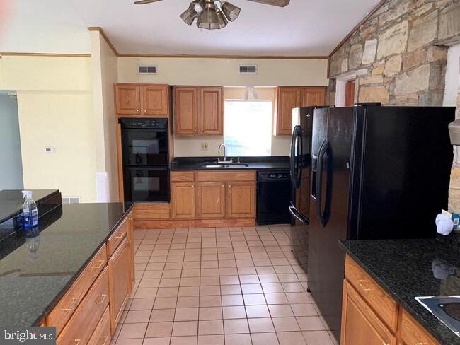 3424 Jermantown Road Fairfax, VA 22030 - Photo 2 of 19 a kitchen with stainless steel appliances granite countertop a refrigerator and a sink