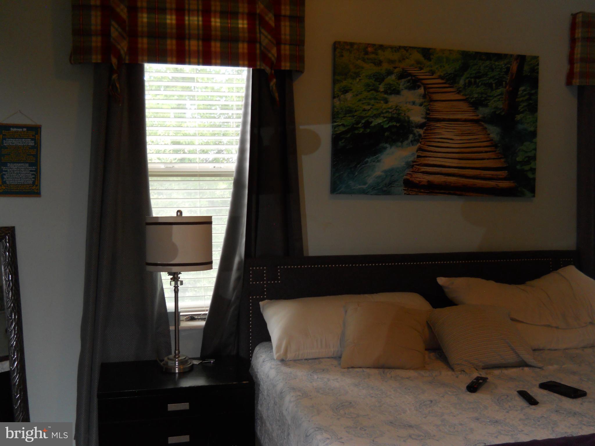 3424 Jermantown Road Fairfax, VA 22030 - Photo 8 of 19 a bedroom with a bed and a window