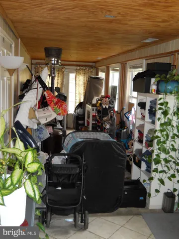 a room with lots of potted plants