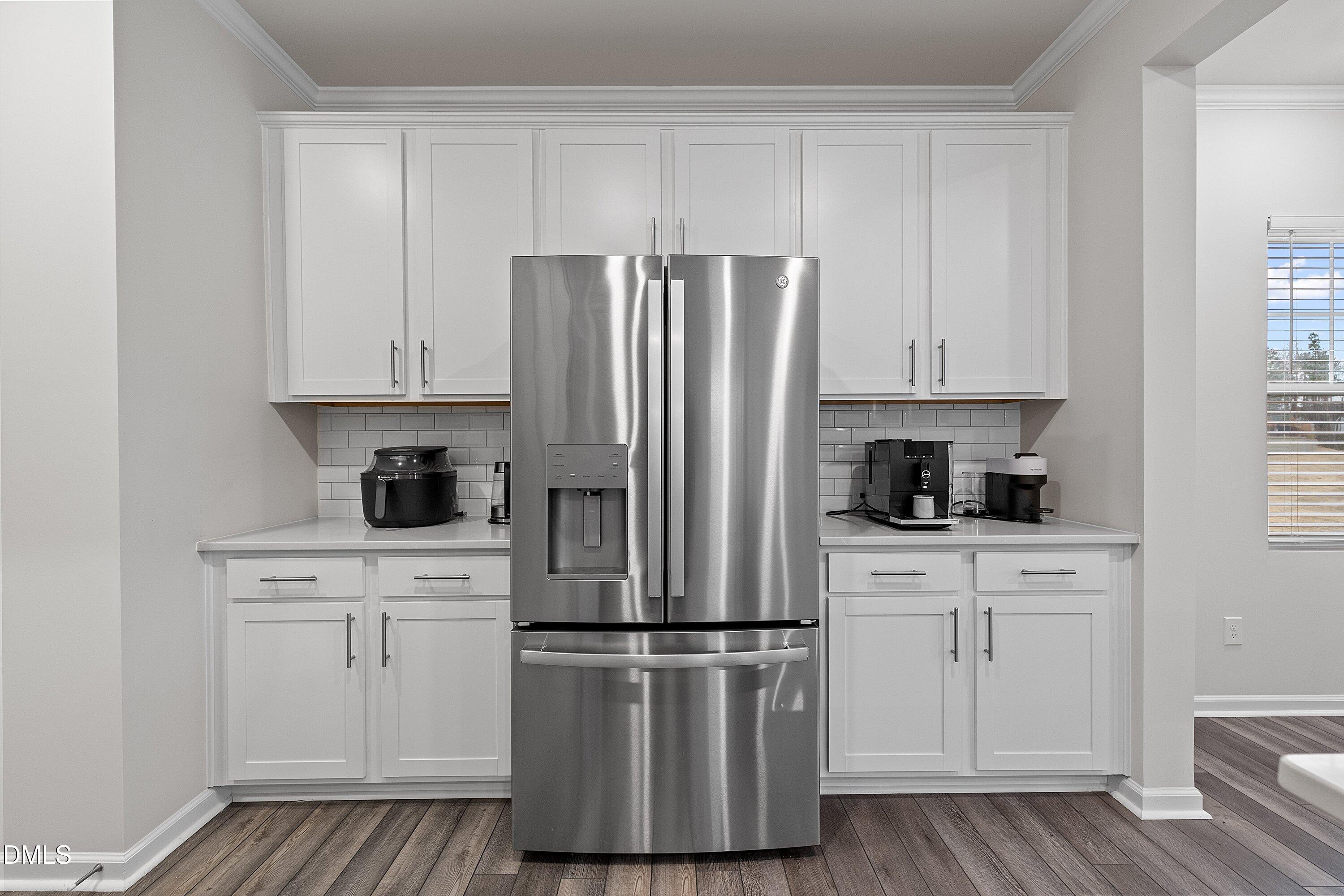 4028 Mount Moran Road Raleigh, NC 27616 - Photo 11 of 46 a kitchen with cabinets and stainless steel appliances