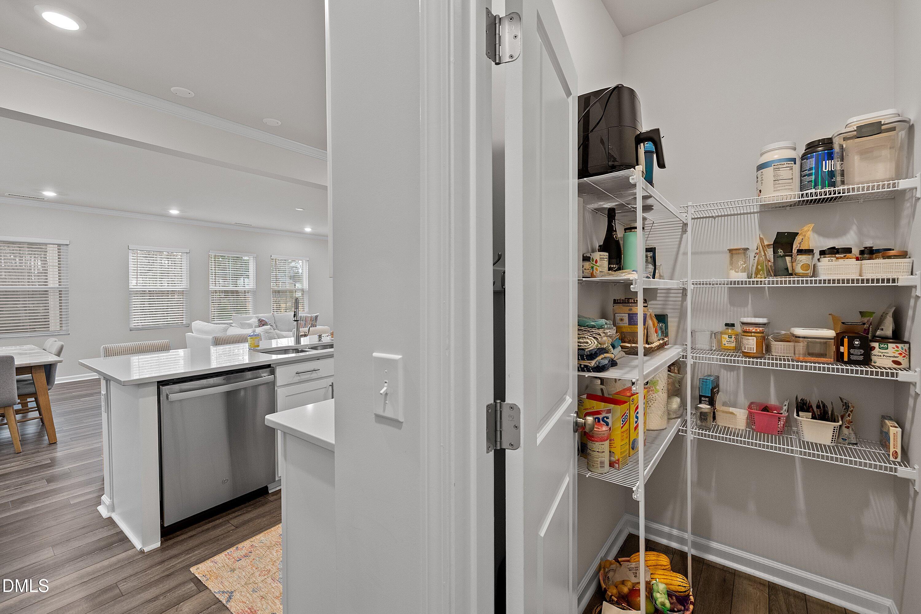 4028 Mount Moran Road Raleigh, NC 27616 - Photo 13 of 46 a kitchen with stainless steel appliances granite countertop a sink and cabinets
