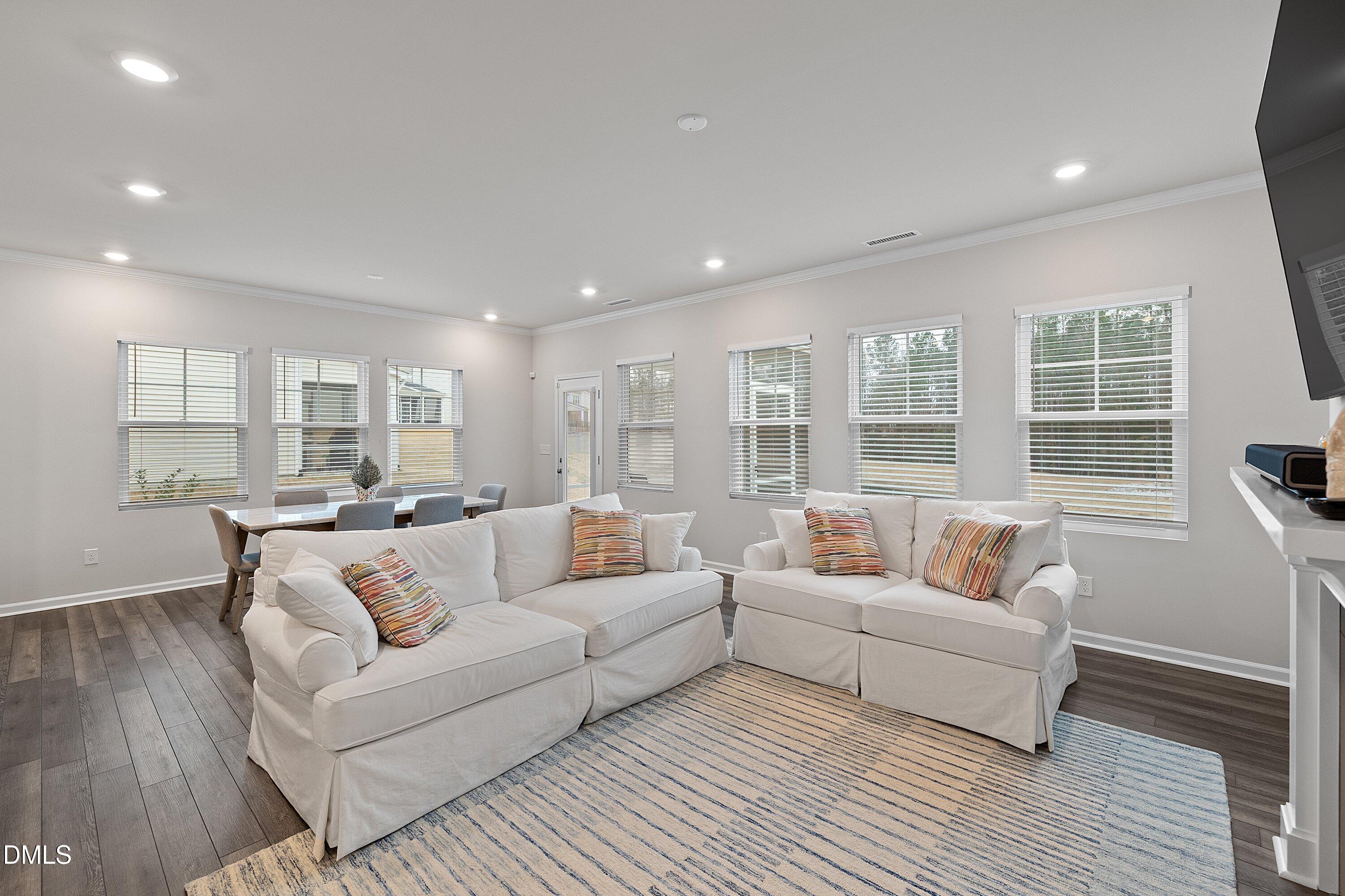 4028 Mount Moran Road Raleigh, NC 27616 - Photo 19 of 46 a living room with furniture and a large window