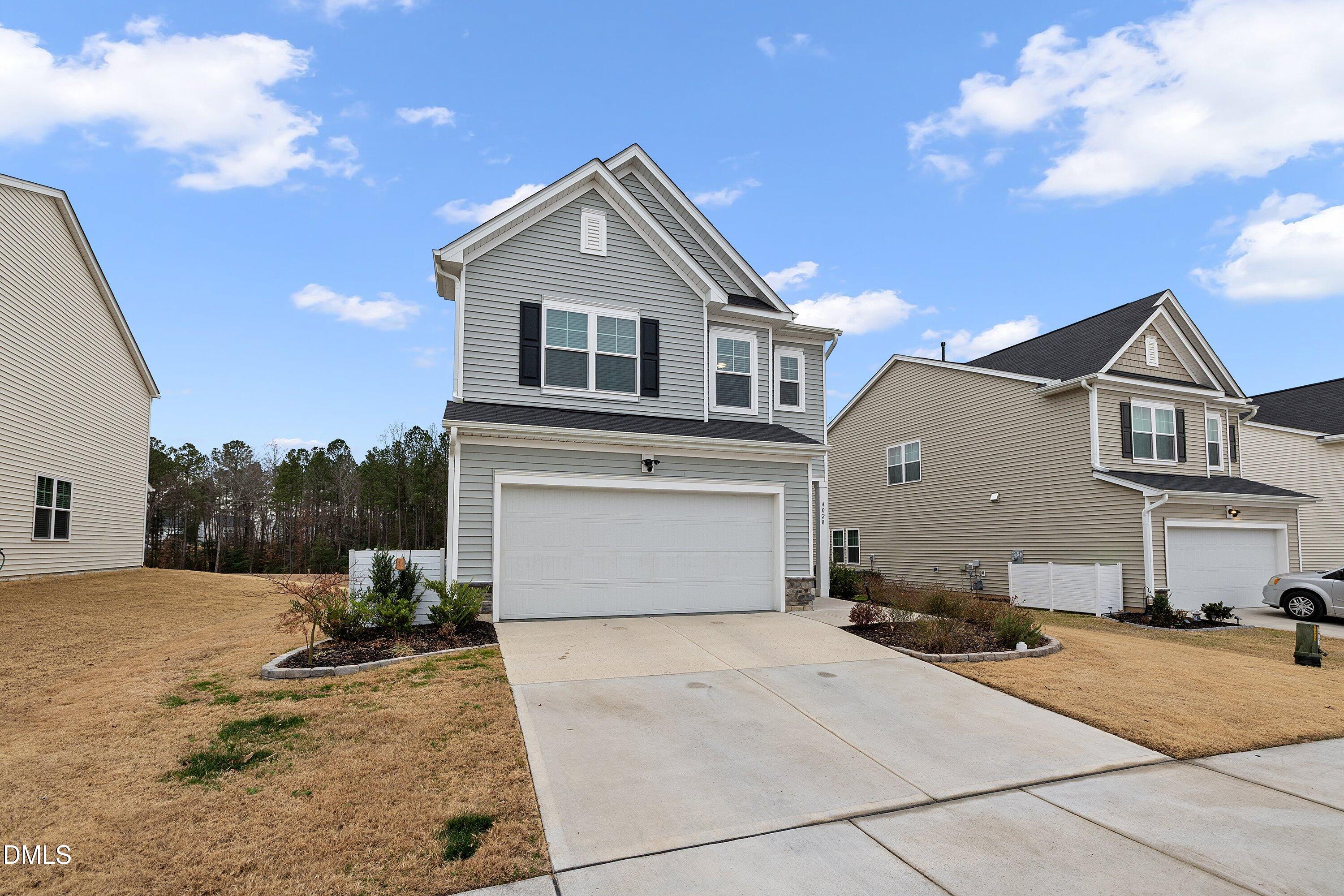 4028 Mount Moran Road Raleigh, NC 27616 - Photo 2 of 46 a front view of a house with a yard