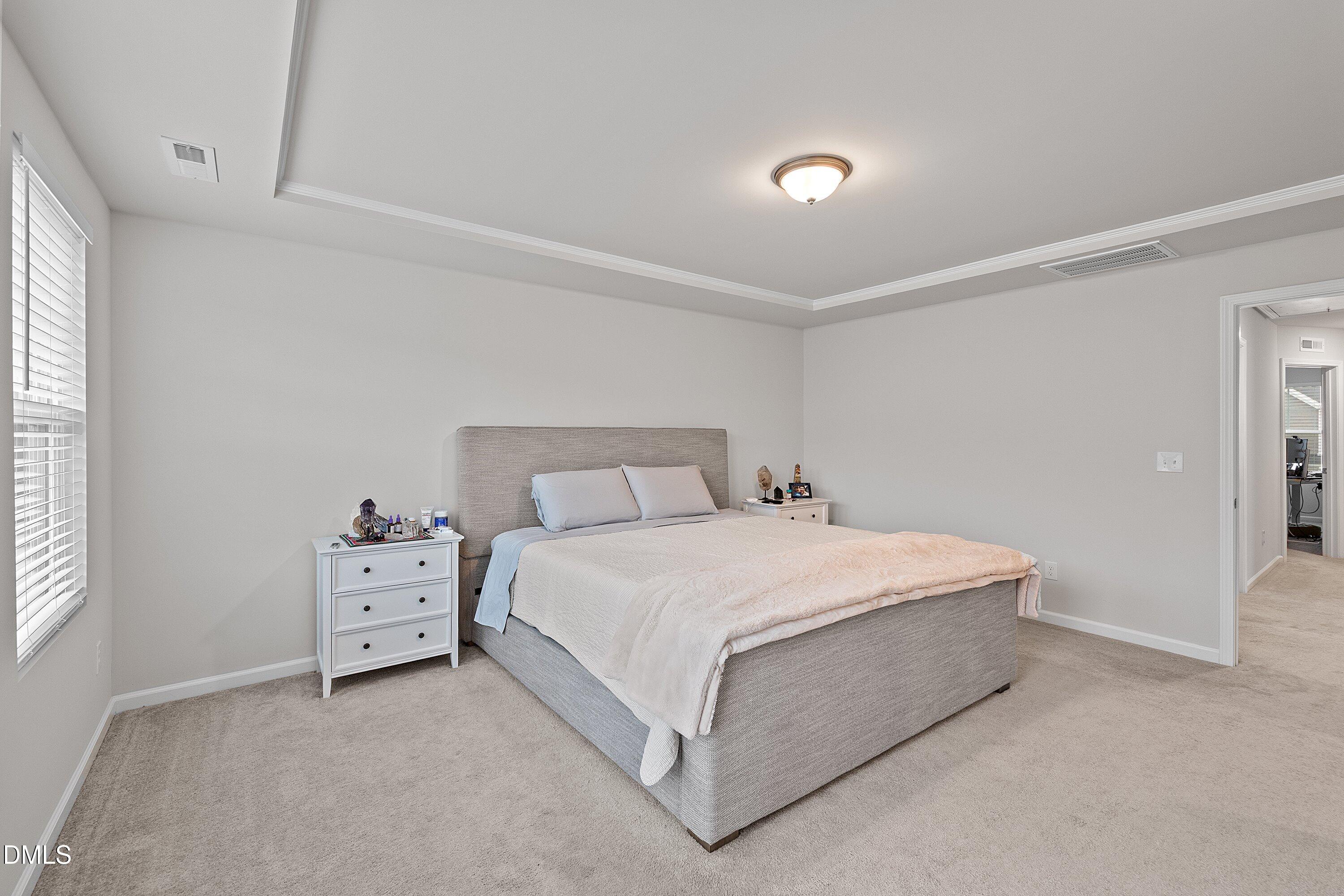 4028 Mount Moran Road Raleigh, NC 27616 - Photo 23 of 46 a bedroom with a bed and window