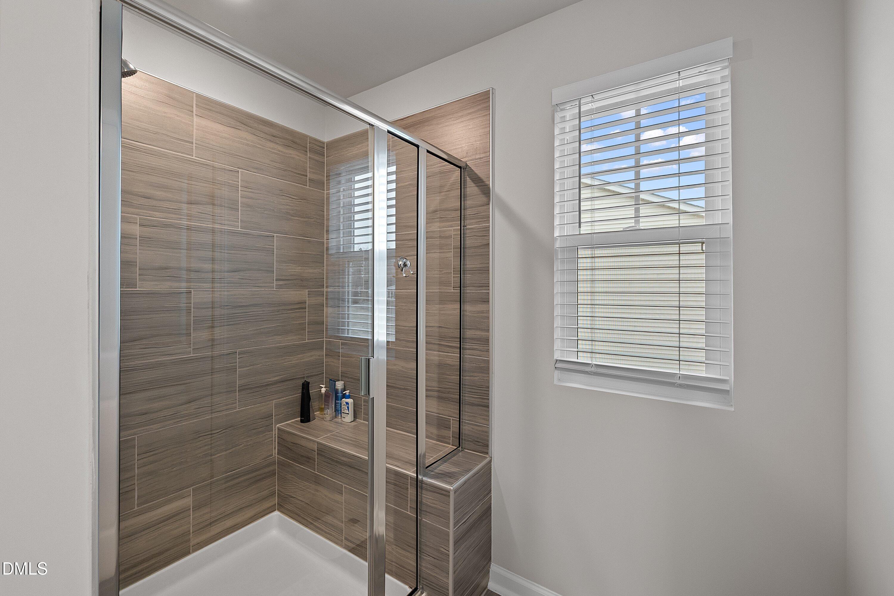 4028 Mount Moran Road Raleigh, NC 27616 - Photo 27 of 46 a bathroom with a window and a shower