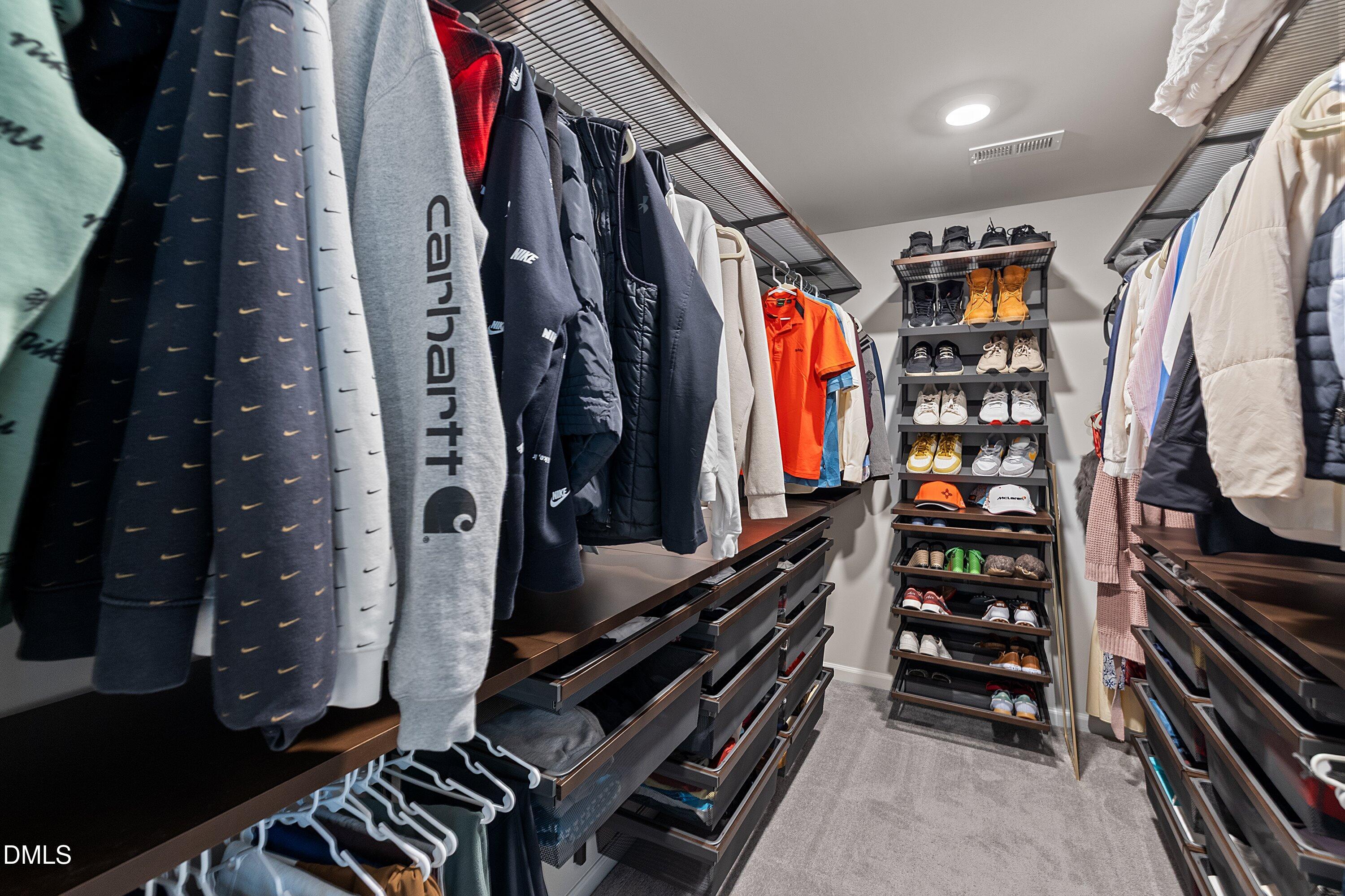4028 Mount Moran Road Raleigh, NC 27616 - Photo 28 of 46 a view of walk in closet with clothes and shoes