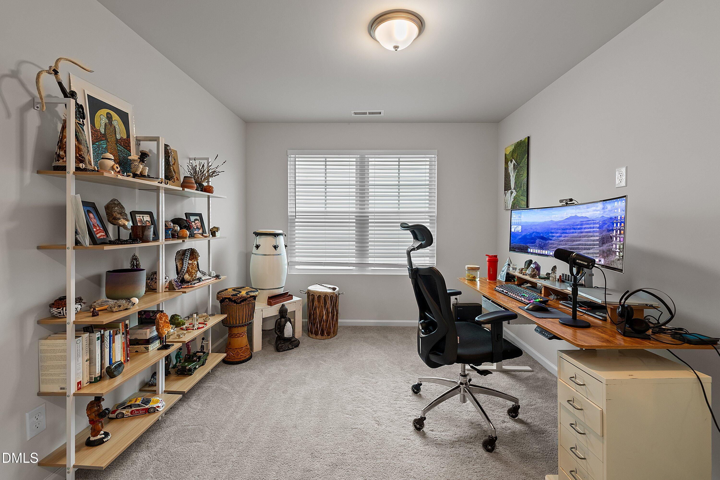 4028 Mount Moran Road Raleigh, NC 27616 - Photo 29 of 46 a view of a workspace with furniture and a window
