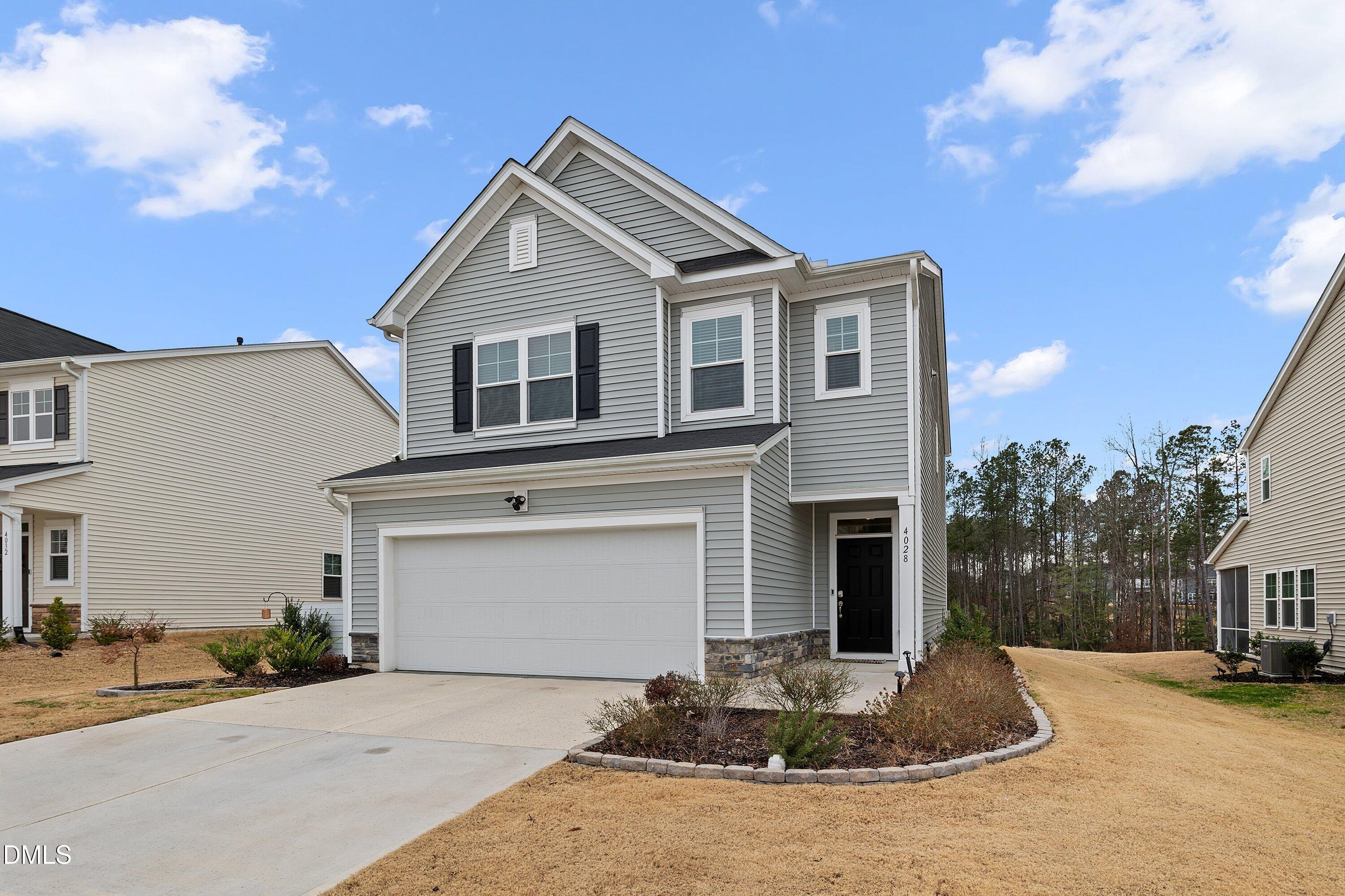 4028 Mount Moran Road Raleigh, NC 27616 - Photo 3 of 46 a front view of a house with entertaining space
