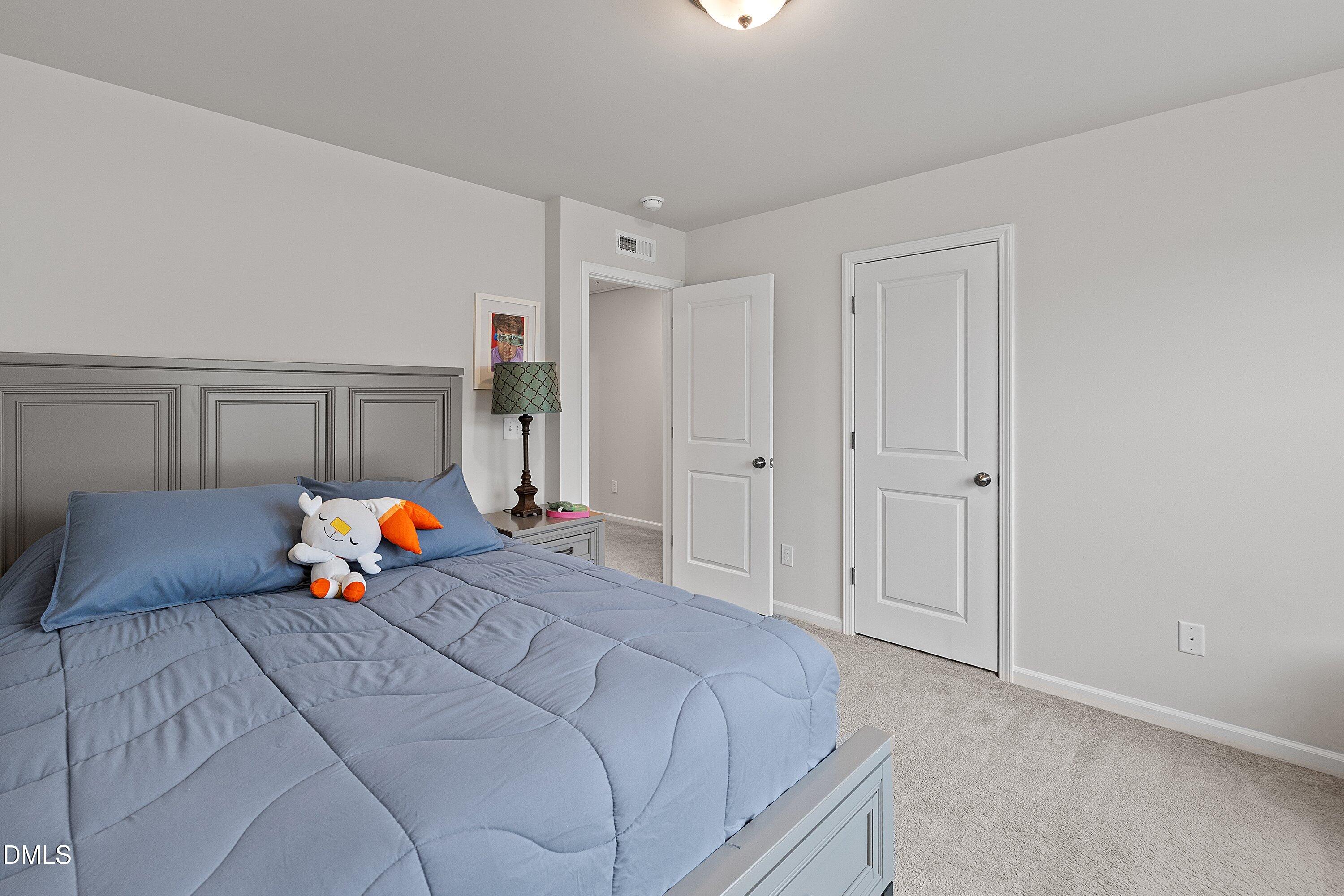 4028 Mount Moran Road Raleigh, NC 27616 - Photo 31 of 46 a bed room with a bed and a window