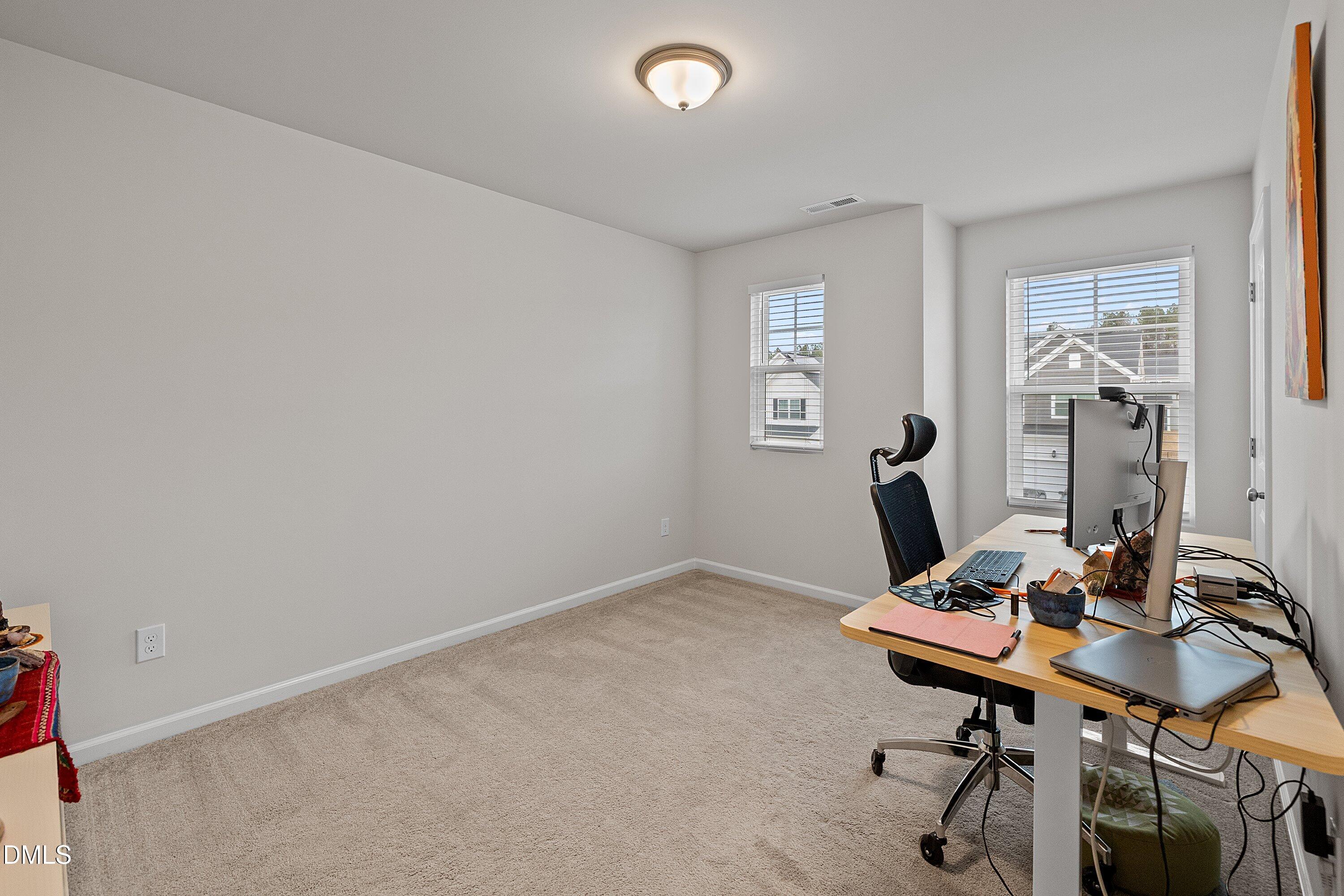 4028 Mount Moran Road Raleigh, NC 27616 - Photo 32 of 46 a view of a workspace with furniture
