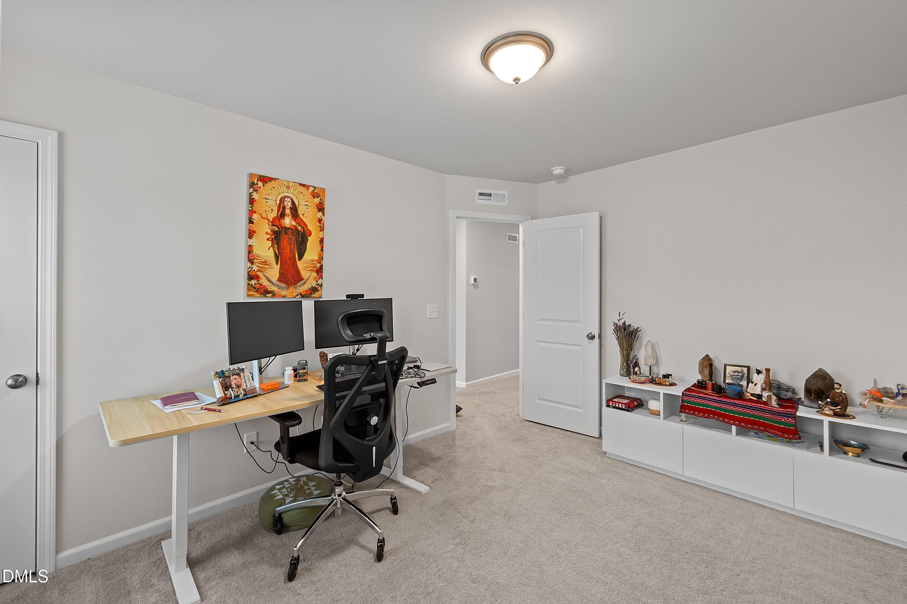 4028 Mount Moran Road Raleigh, NC 27616 - Photo 33 of 46 a view of a workspace with furniture