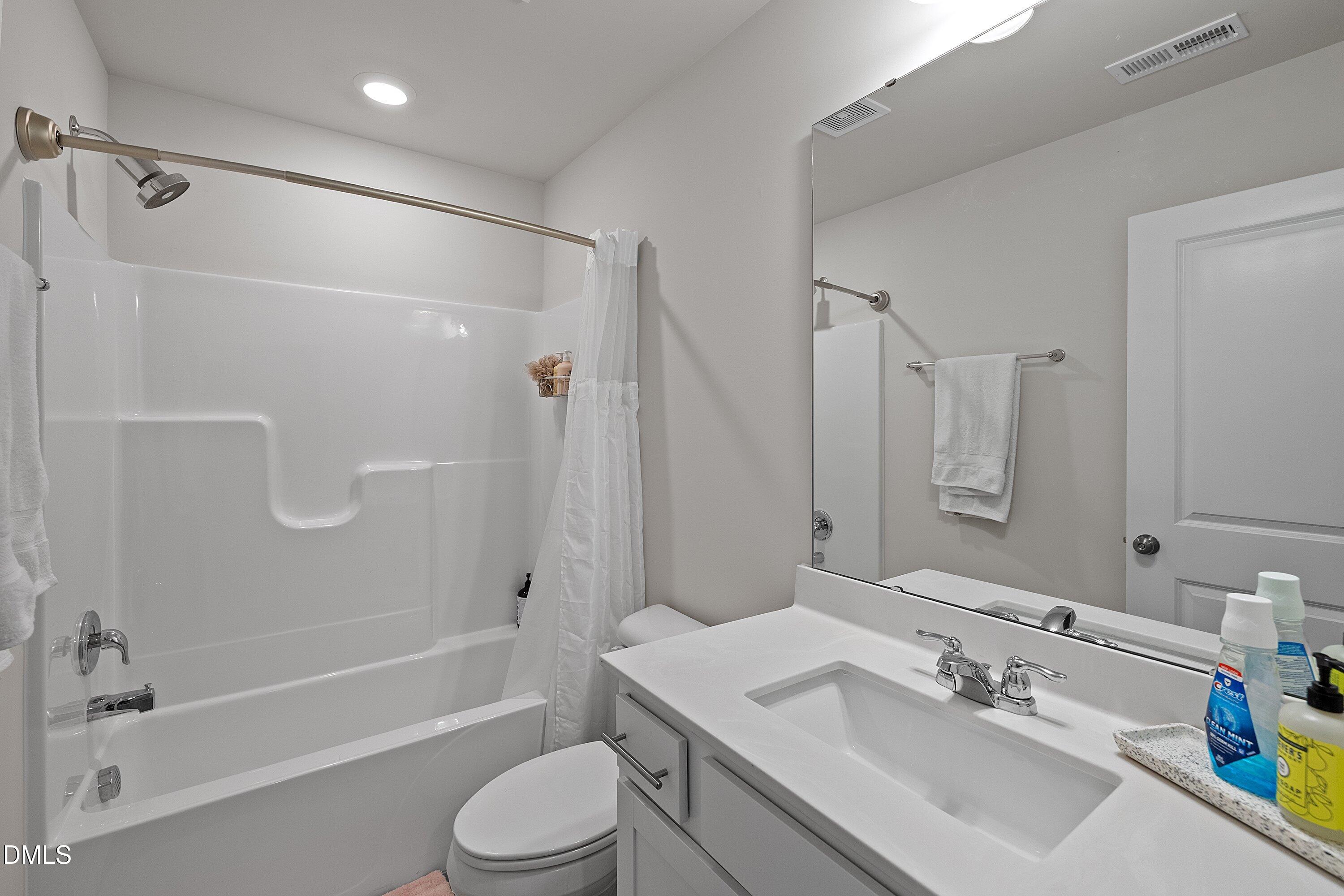 4028 Mount Moran Road Raleigh, NC 27616 - Photo 34 of 46 a bathroom with a sink toilet and shower