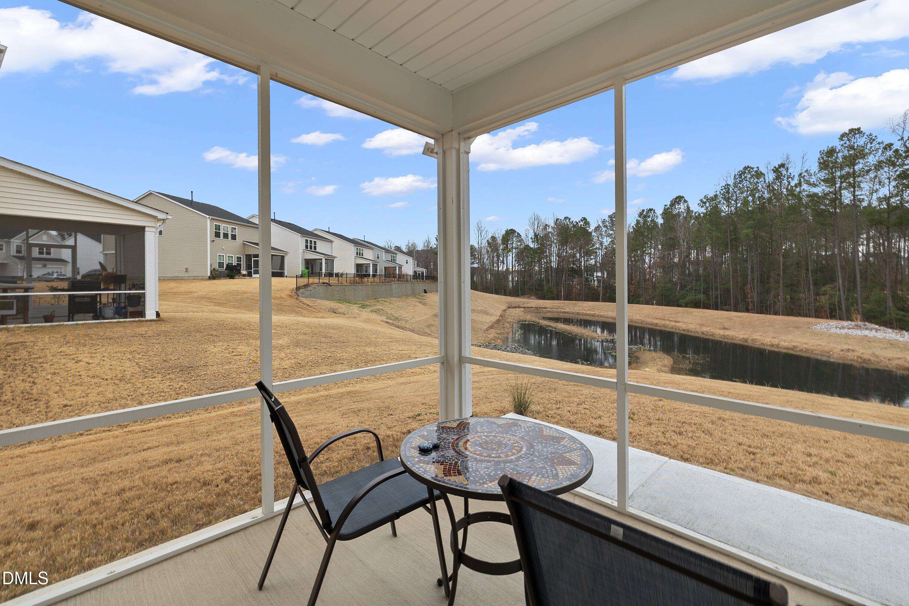 4028 Mount Moran Road Raleigh, NC 27616 - Photo 42 of 46 a view of a balcony with chair and table