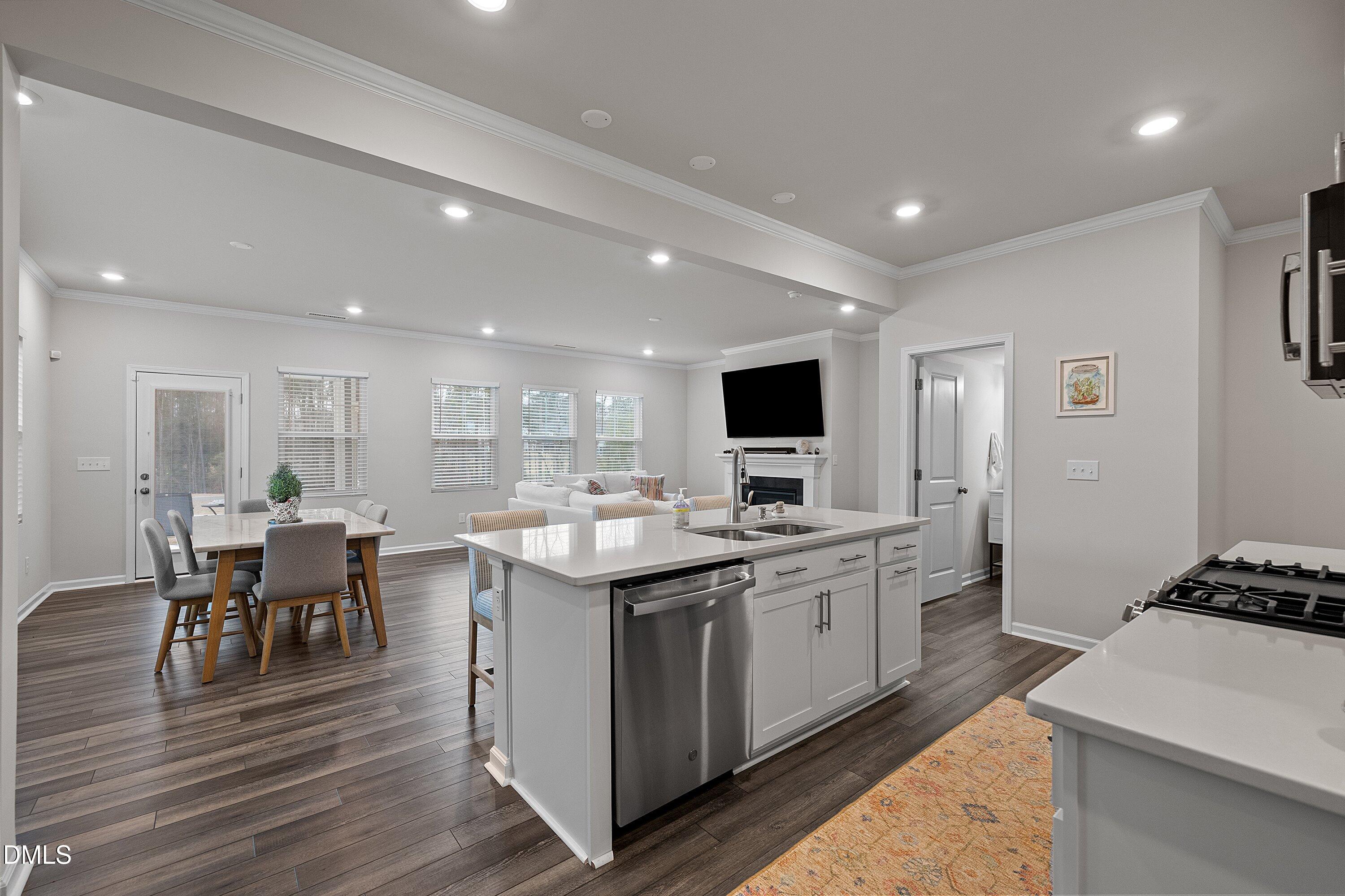 4028 Mount Moran Road Raleigh, NC 27616 - Photo 8 of 46 a kitchen with a sink and wooden floor