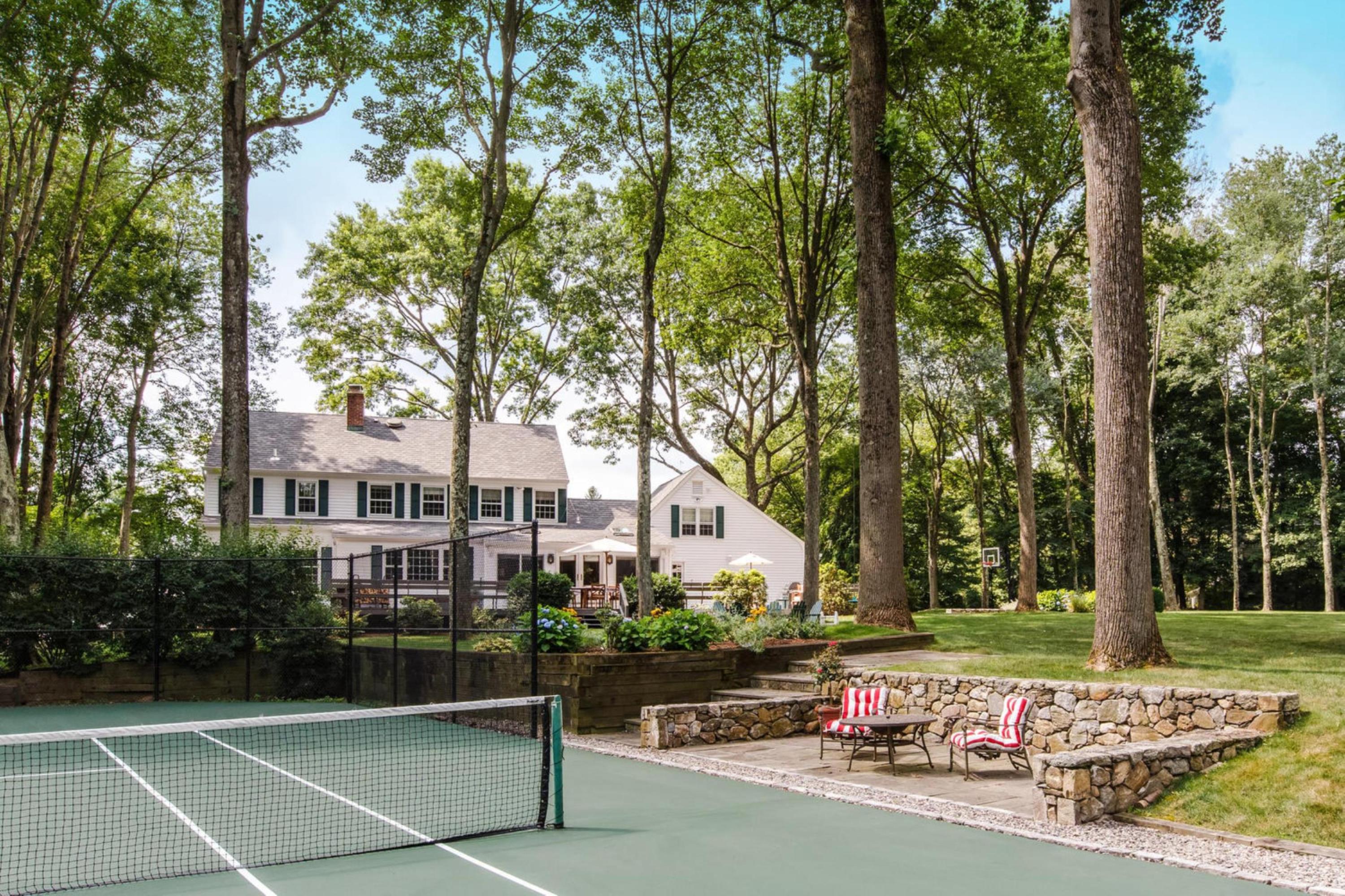 73 Talmadge Hill Road New Canaan, CT 06840 - Photo 1 of 37 a view of a building with a yard and sitting area