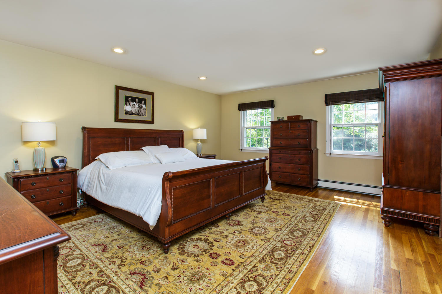 73 Talmadge Hill Road New Canaan, CT 06840 - Photo 14 of 37 a bedroom with a bed and a dresser