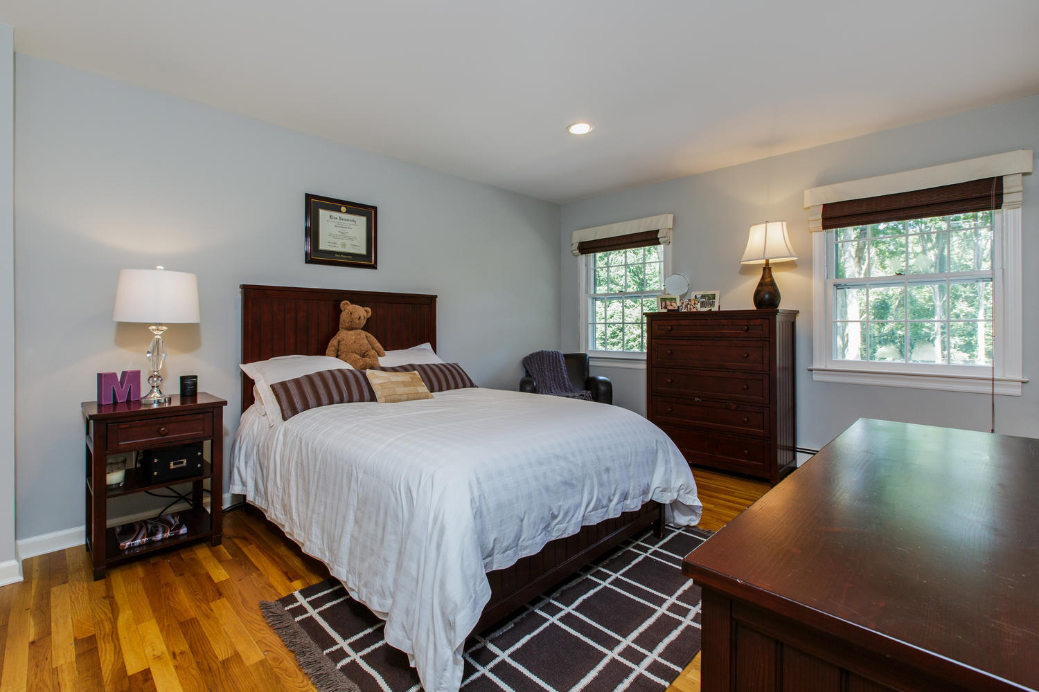 73 Talmadge Hill Road New Canaan, CT 06840 - Photo 18 of 37 a bedroom with a bed and wooden floor