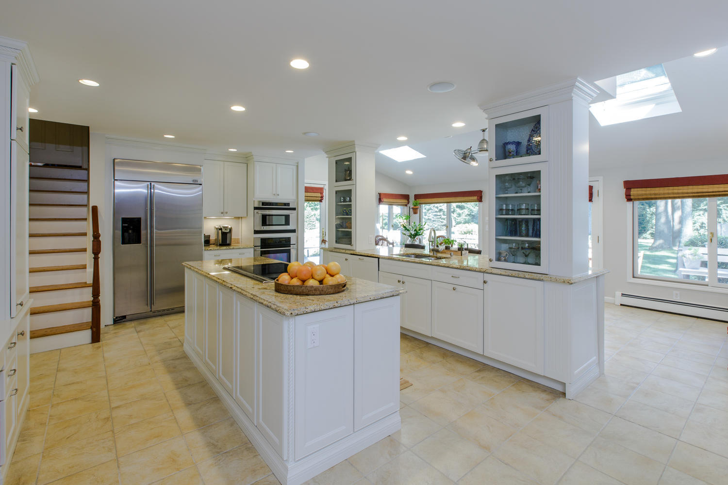 73 Talmadge Hill Road New Canaan, CT 06840 - Photo 8 of 37 a kitchen with stainless steel appliances kitchen island granite countertop a refrigerator and a sink