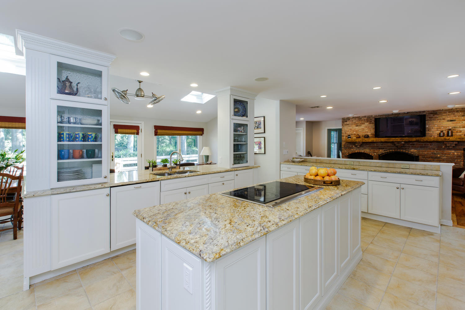 73 Talmadge Hill Road New Canaan, CT 06840 - Photo 9 of 37 a kitchen with stainless steel appliances granite countertop a sink and a white cabinets