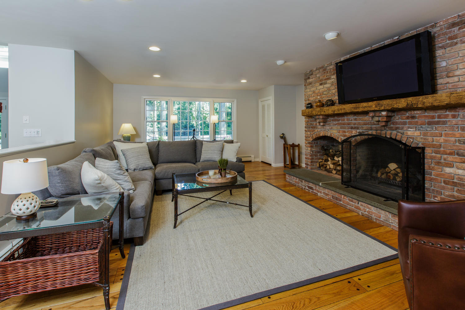 73 Talmadge Hill Road New Canaan, CT 06840 - Photo 10 of 37 a living room with furniture a flat screen tv and a fireplace