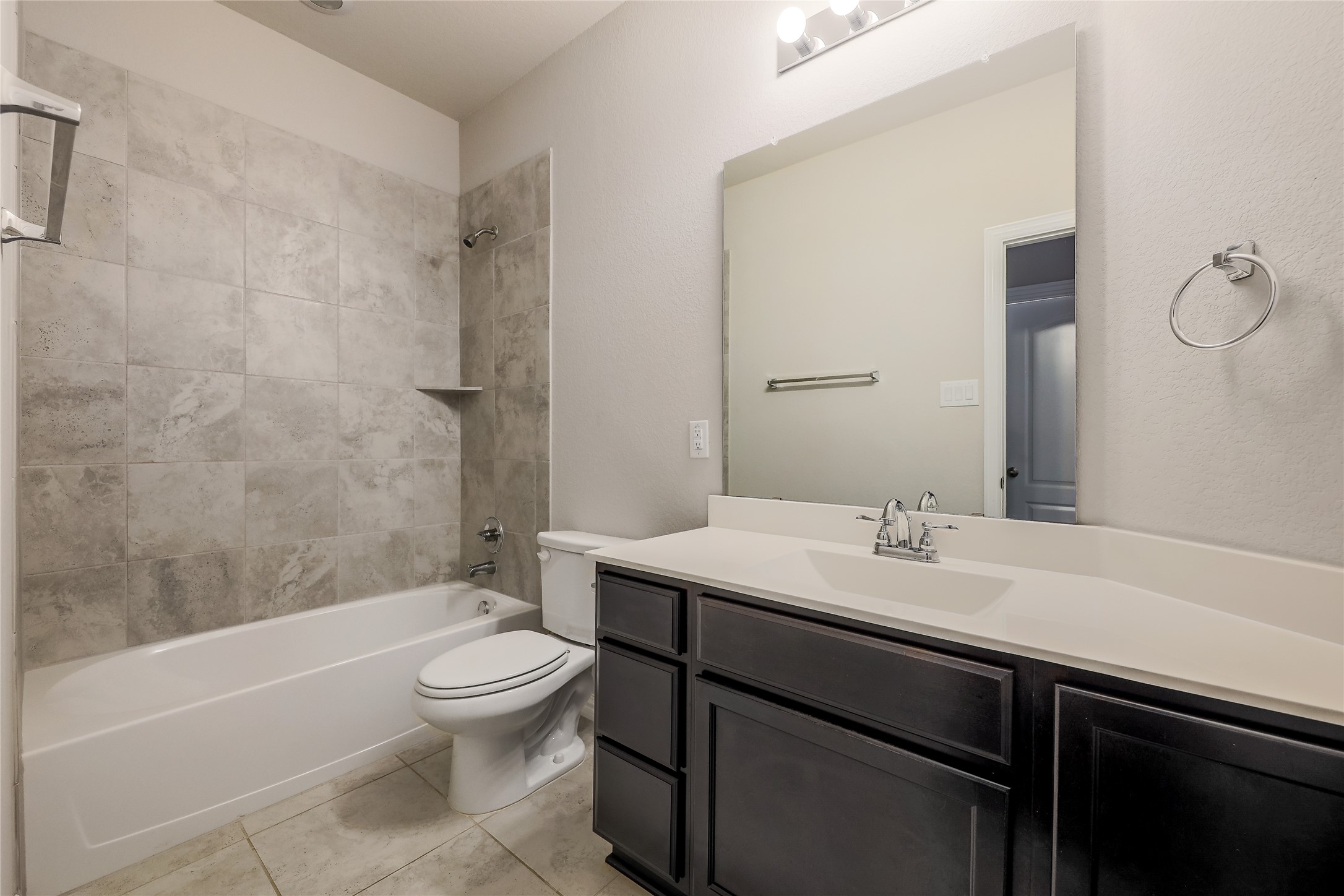 205 Penna Lane Georgetown, TX 78628 - Photo 21 of 32 A well-appointed bathroom with a spacious vanity, sleek tiling, and bright fixtures offers comfort and style.