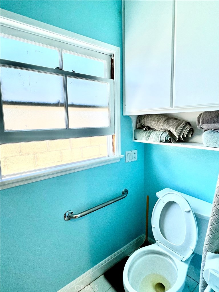 1100 Drake Road Arcadia, CA 91007 - Photo 15 of 21 a bathroom with a toilet mirror and vanity
