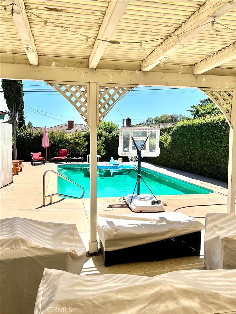 1100 Drake Road Arcadia, CA 91007 - Photo 17 of 21 a view of swimming pool with a patio and a yard