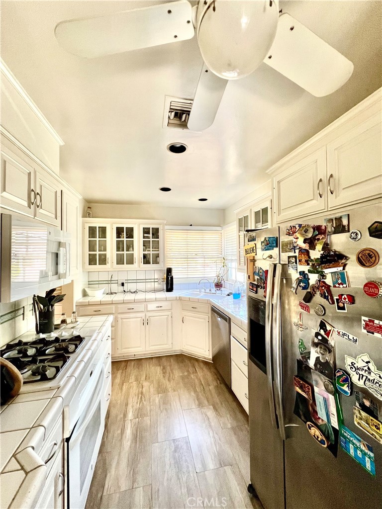 1100 Drake Road Arcadia, CA 91007 - Photo 3 of 21 a large kitchen with lots of counter space and wooden floor