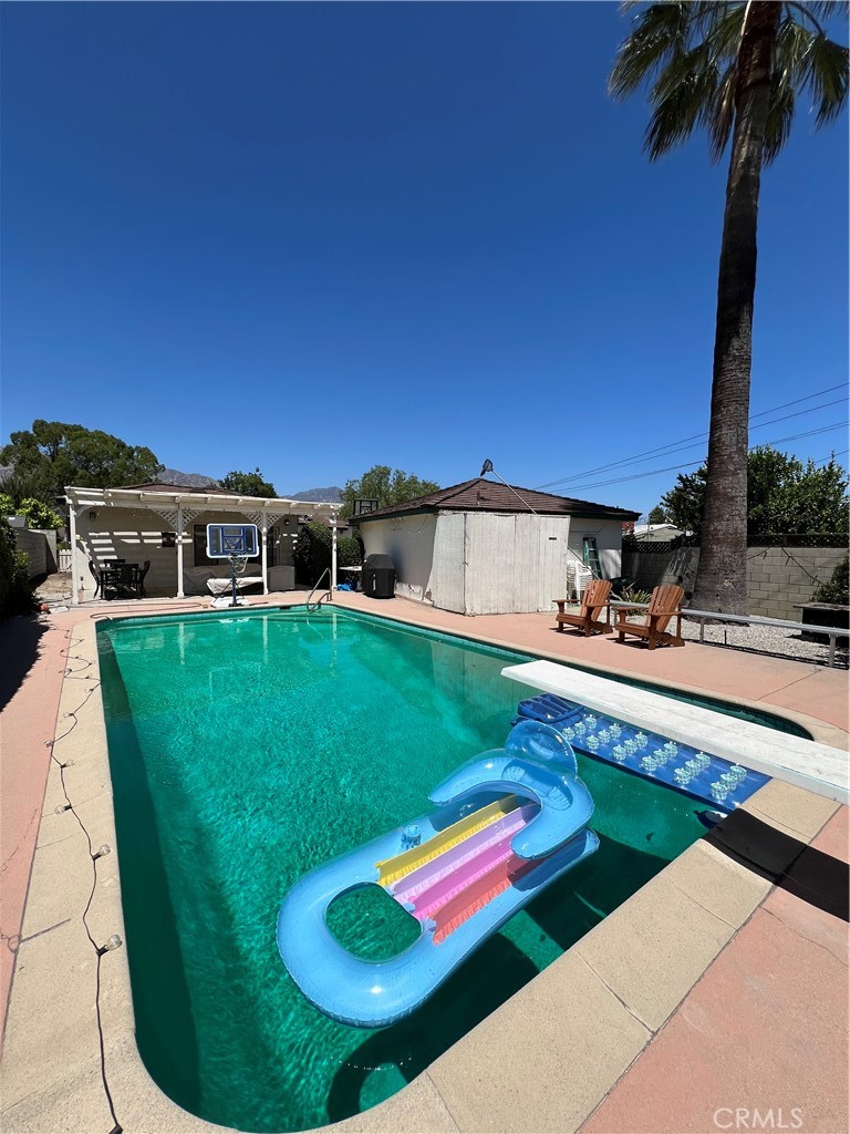 1100 Drake Road Arcadia, CA 91007 - Photo 7 of 21 a view of a swimming pool with a yard